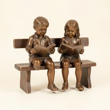 Boy And Girl Reading Books On Bench Bronze Statue - Size : 48 '' L X 29 '' W X 39 '' H . (synthetic illustration; no displayed measurements)