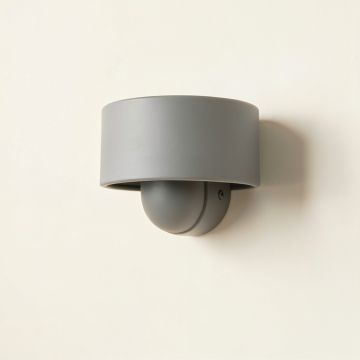 Spruce Branch Wall Sconce Mounted On A Plain Wall - Gray (synthetic illustration; no displayed measurements)