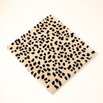 Penley Animal Print Tufted Wool Beige/Black Area Rug (synthetic illustration; no displayed measurements)