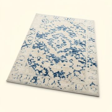 Hussain Abstract Ivory/Blue Area Rug (synthetic illustration; no displayed measurements)