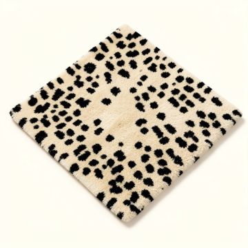 Thornbury Animal Print Tufted Wool Beige/Black Area Rug (synthetic illustration; no displayed measurements)