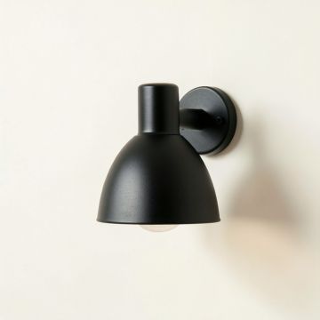Aspen Bend Wall Sconce Mounted On A Plain Wall - Black (synthetic illustration; no displayed measurements)