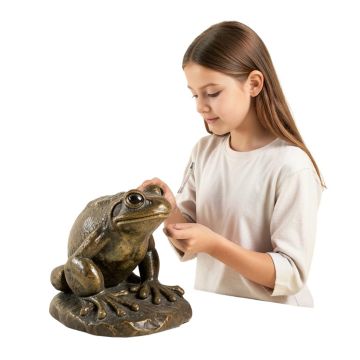 Girl Looking At A Frog Statue