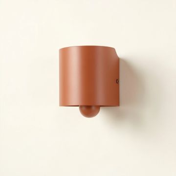 Cliff Arc Wall Sconce Mounted On A Plain Wall (synthetic illustration; no displayed measurements)
