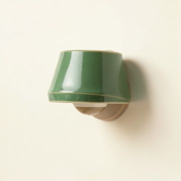 Holly Arc Wall Sconce Mounted On A Plain Wall (synthetic illustration; no displayed measurements)