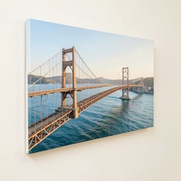 Panoramic Suspension Bridge Across A Bay (synthetic illustration; no displayed measurements)
