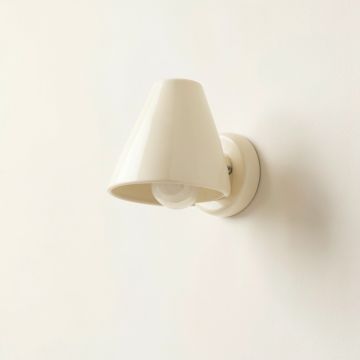 Slate Crest Wall Sconce Mounted On A Plain Wall - Cream (synthetic illustration; no displayed measurements)