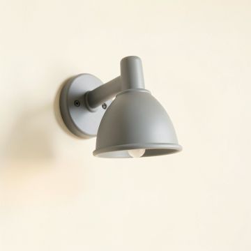 Slate Bend Wall Sconce Mounted On A Plain Wall - Gray (synthetic illustration; no displayed measurements)