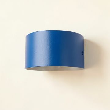 Juniper Crest Wall Sconce Mounted On A Plain Wall - Blue (synthetic illustration; no displayed measurements)