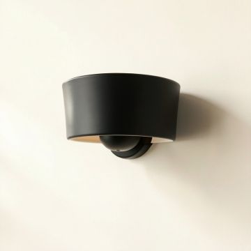 Cove Arc Wall Sconce Mounted On A Plain Wall (synthetic illustration; no displayed measurements)
