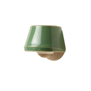 Holly Arc Wall Sconce Mounted On A Plain Wall